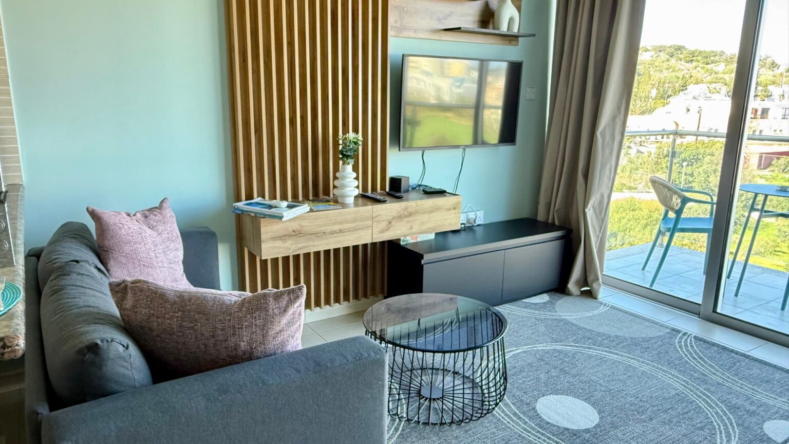 Coralli A309 studio in Protaras after furnishing by Too Coool, living area with media wall